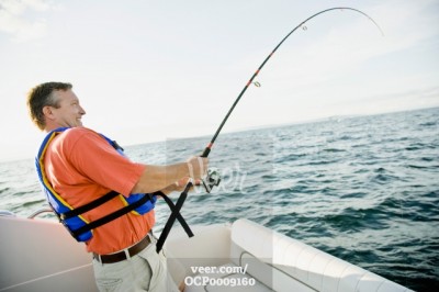 Man-fishing-on-boat-OCP0009160.jpg