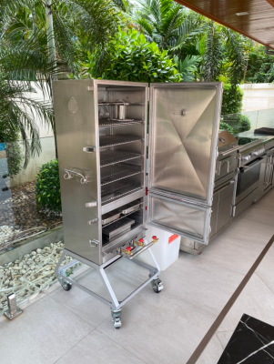 Quik-Fire 6 rack smoker open in it's beautiful new home.png